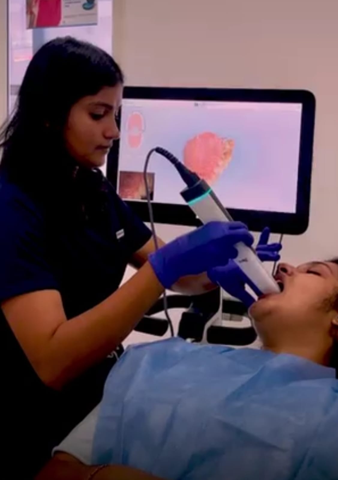 Patient receiving painless no-shot laser dental fillings